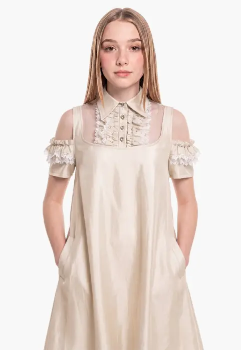 A flowing dress with off-the-shoulder sleeves and lace details. image 1