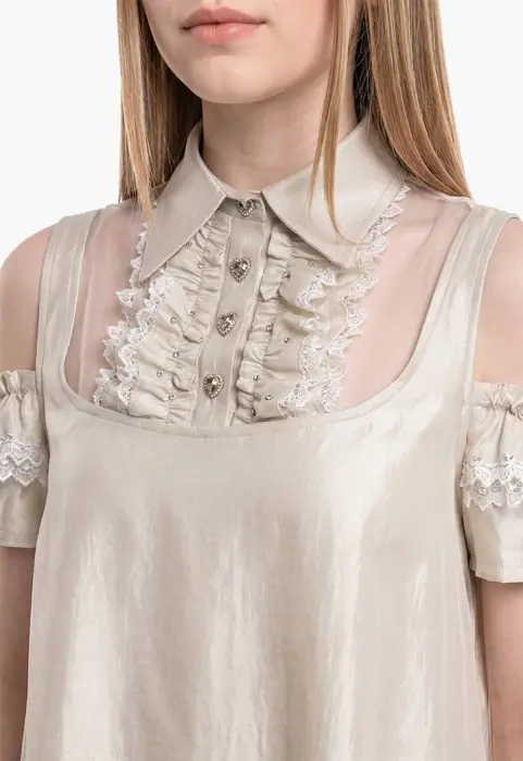 A flowing dress with off-the-shoulder sleeves and lace details. image 6