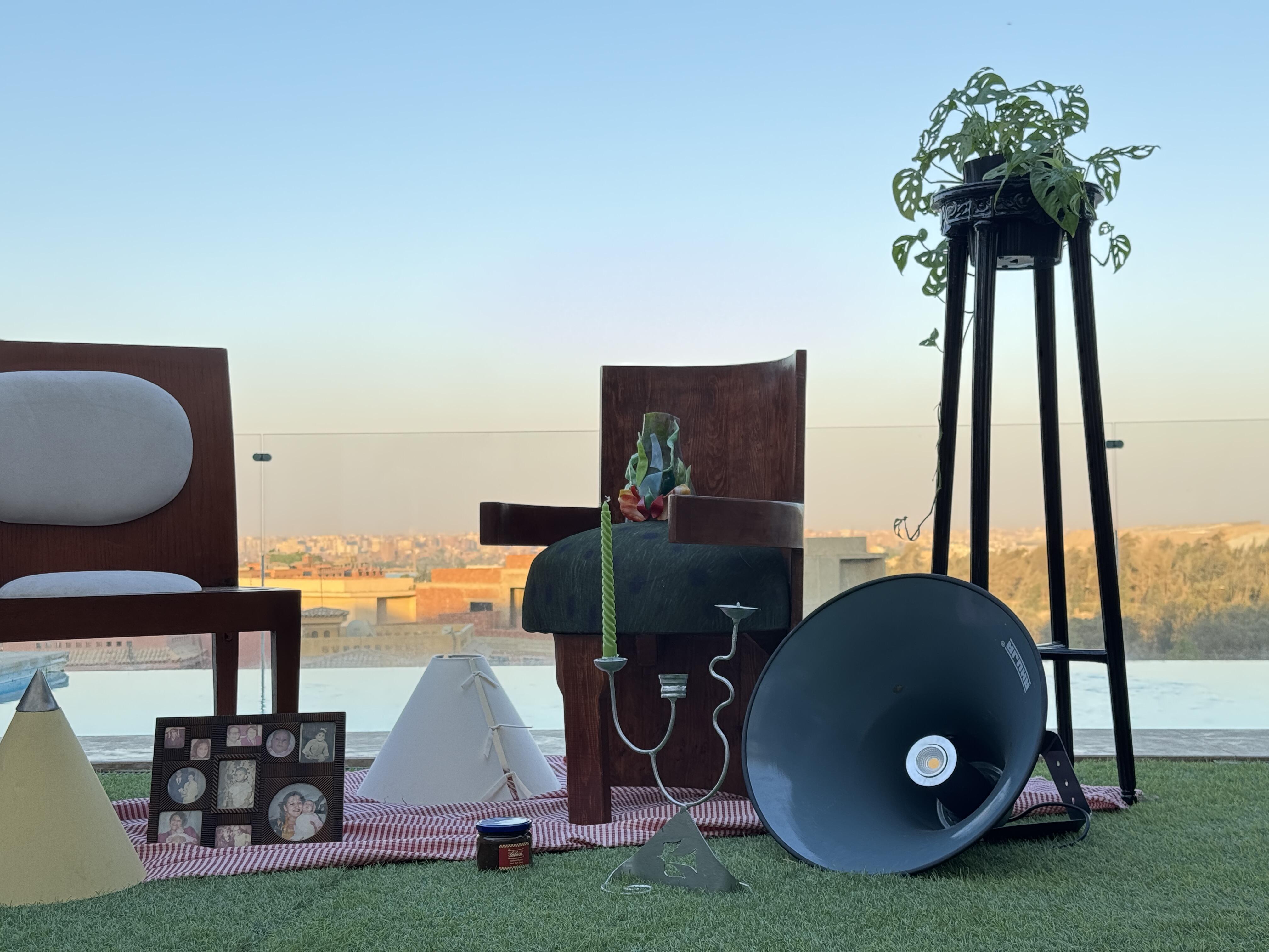 Studio seating with objects and greenery on a rooftop terrace